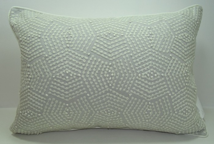 Geometric embroidered cushion