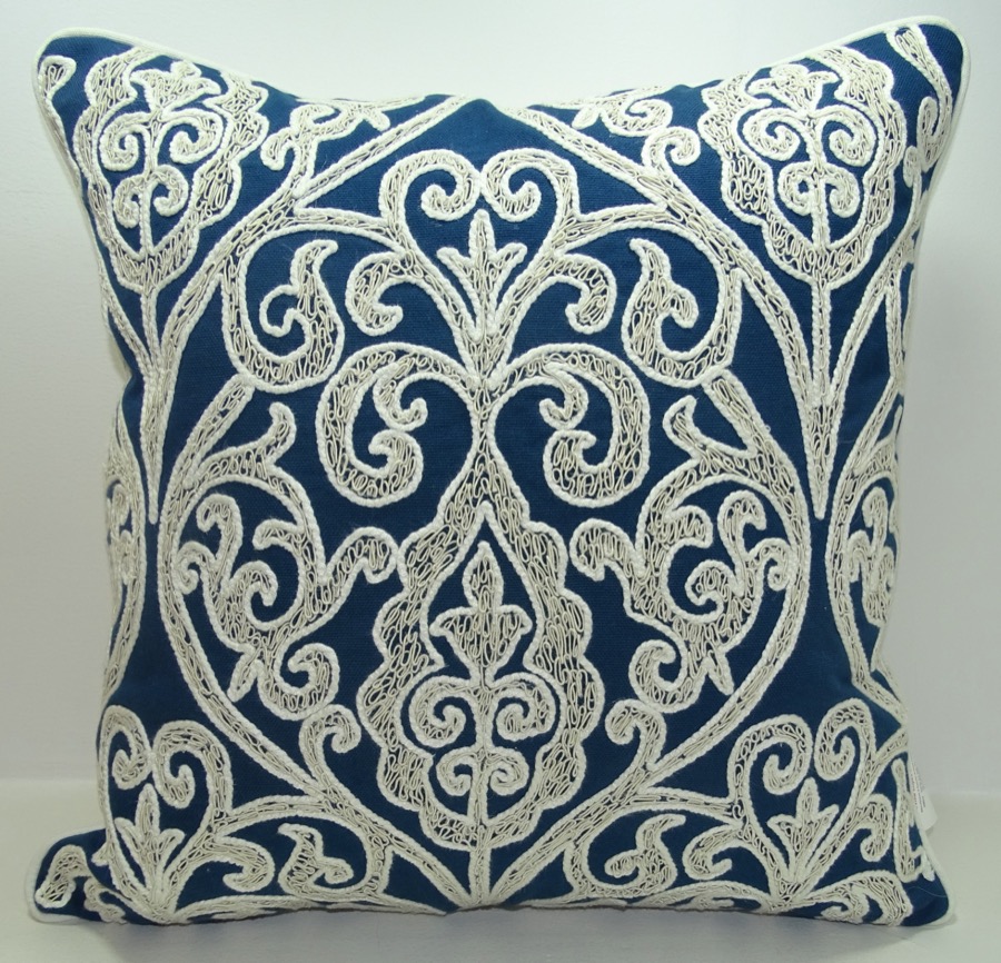 Hand-embroidered scroll cushion in indigo